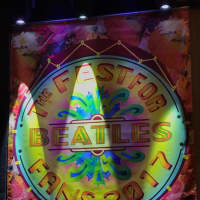 <p>Stage lights shine on the logo for this year&#x27;s Fest for Beatles Fans at  Hyatt Regency Jersey City on the Hudson. Festivities start Friday.</p>