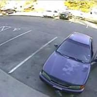 <p>The suspect in the Wilton bank robbery with his car, a 1997 four-door Honda Accord.</p>
