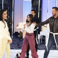 <p>Shriya Jha (holding the board) coaches "American Idol" judge Katy Perry on how to break a board during her audition on an unaired segment on Sunday's show.&nbsp;</p>