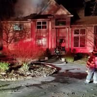 <p>A home on Robin Lane in Bedford received extensive damage from a fire Sunday.</p>