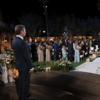 <p>Tommy Nist walks Theresa Nist down the aisle to Gerry Turner.</p>