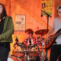 <p>School of Rock musicians will perform at the Brewster Ice Arena. Pictured:  (L to R): Erin Blake (Bedford), Devin Buckley (Somers), Brian Macomber (Carmel).</p>