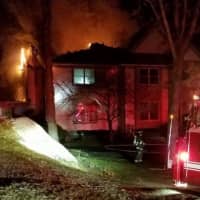 <p>Banksville and Bedford firefighters battle a fire on Robin Lane in Banksville.</p>