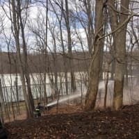 <p>Firefighters from the Mohegan Volunteer Fire Department battled a fast-moving brush fire in Cortlandt Manor on Thursday.</p>