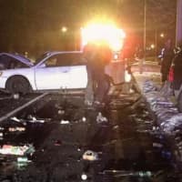 <p>The Long Hill Fire Department assists at the scene of a two-car crash on the Merritt Parkway at Route 25 late Friday.</p>