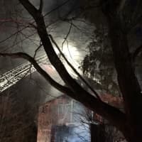 <p>Firefighters at work at the barn fire in Georgetown.</p>