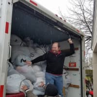 <p>Packing a U-Haul full of donations in Eastchester as part of a volunteer effort by Greater NYC Families for Syria.</p>