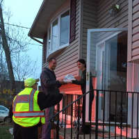 <p>Congers firefighters deliver food from a local restaurant to teach about fire safety.</p>