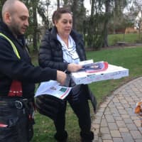 <p>Pizza and a smoke alarm are delivered by Conger&#x27;s firefighters.</p>