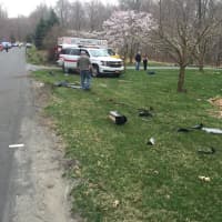<p>Debris from the car crash was thrown across the roadways and nearby yards.</p>