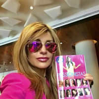 <p>Cindy Massari of Katonah with her book, &quot;Passionistas: Tips, Tales &amp; Tweetables from Women Pursuing Their Dreams.&quot;</p>