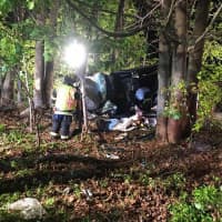 <p>Briarcliff Manor firefighters work to free a man from a fatal crash.</p>