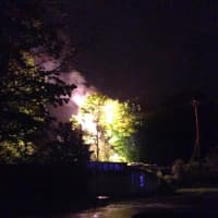<p>A fire on a utility pole near the &quot;Graffiti Bridge&quot; in Brookfield lights up the sky late Saturday.</p>
