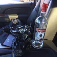 <p>A man was arrested for drinking and driving with an open bottle of vodka.</p>