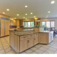 <p>The kitchen includes new, granite countertops and a view of the yard.</p>