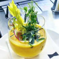 <p>Simple, heirloom tomato gazpacho with basil oil and garden herbs from Aesop&#x27;s Fable Restaurant in Chappaqua.</p>