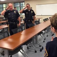 <p>Sheriff&#x27;s officers salute their &quot;Chief for a Day.&quot;</p>