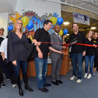 <p>New Rochelle Councilman Jared Rice with the staff and founders of A-Game Sports at the ribbon cutting ceremony.</p>