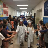 <p>Haldane students walk through the middle school before graduation</p>
