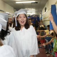 <p>Dobbs Ferry grads walk the hall of their old elementary school</p>