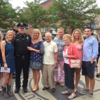 <p>New Brookfield Police Officer Tommy Robbins is surrounded by his friends and family after graduating Monday from the State Of Connecticut Police Academy.</p>