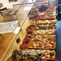 <p>Pizza Mia in Newburgh always has a large assortment of pies on hand.</p>