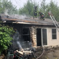 <p>Fire crews in Hunterdon County arrived “in about a minute” at the scene of a brush fire that fully engulfed an adjacent home Friday morning.</p>