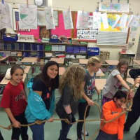 <p>Wayne students participate in a group activity with a rope.</p>