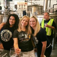 <p>Fans enjoy the soft opening of Lock City Brewing in Stamford.</p>