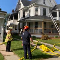 <p>Firefighters at the scene of an Allyn Street fire in Holyoke on Friday, June 11.</p>
