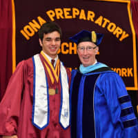 <p>Iona Preparatory School Valedictorian Peter Calicchia, 18, of Tuckahoe, left, receives the Brother William M. Stoldt, CFC Memorial Award for General Excellence from Bro. Thomas Leto, Iona Prep president, during commencement exercises.</p>