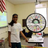 <p>A student shows her project at the March 5 STEMFest.</p>