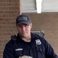 <p>City of Poughkeepsie officer with an alligator found in a local park.</p>