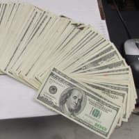 <p>Suffolk County Police Department detectives intercepted $17,000 mailed from Montana as part of a bail scam.</p>