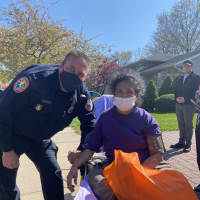 <p>Nassau County Police Officer Robert Simon came to the rescue of a 57-year-old woman when a fire broke out in Searington.</p>