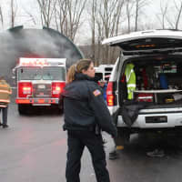 <p>CPD Officer Macon keeps a watchful eye on the firefighters working the scene in Mahopac.</p>