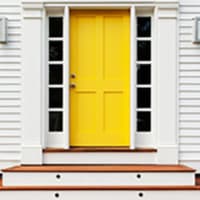 <p>Inviting Yellow pops up more and more as a front door color, especially on white homes.</p>