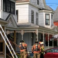 <p>Firefighters at the scene of an Allyn Street fire in Holyoke on Friday, June 11.</p>
