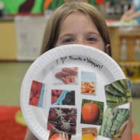 <p>Children at HealthBarn USA made collages of their favorite fruits and vegetables.</p>