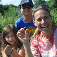 <p>HealthBarn USA founder Stacey Antine, right, picks organic blackberries that she grew at Abma&#x27;s Farm in Wyckoff with a children&#x27;s program.</p>
