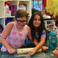 <p>Youngsters help out in the kitchen at HealthBarn USA, coming to Ridgewood in December.</p>