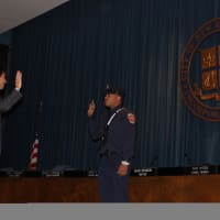 <p>New Rochelle Mayor Noam Bramson swearing in the newest firefighter.</p>