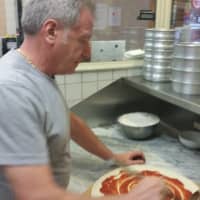 <p>Angelo Oliviero saucing up a pie.</p>