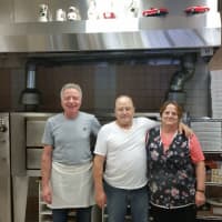 <p>Brothers and owners of Vincent&#x27;s Pizzeria, Angelo and Vincent with his wife. Alba.</p>