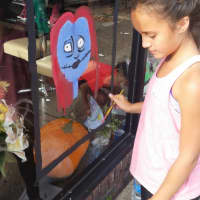 <p>Euclid School Fifth Grader Anastasia Cerda paints a character from the Nightmare Before Christmas.</p>