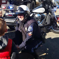 <p>Rutherford Police Officer Steve Villareale talks to kids about motorcycle safety.</p>