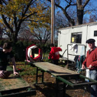 <p>Ridgefield Park-Bogota Rotary and local Boy Scouts prepare trees at an annual Christmas tree sale. </p>