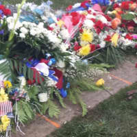 <p>Flowers left at the graveside of Tech. Sgt. Joseph Lemm of West Harrison who was buried at Gate of Heaven Cemetery in Hawthorne on Wednesday.</p>
