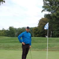<p>A player on a green during the 21st Annual Golf Classic to benefit the Wyckoff Family YMCA.</p>