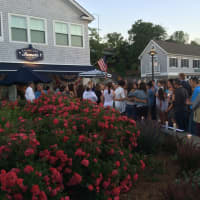 <p>About 50 gathered for a candlelight vigil for the victims of the Orlando nightclub shootings.</p>